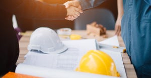 Businessman and engineer handshake closing a deal in construction site. Sucessful,engineering and business concept.