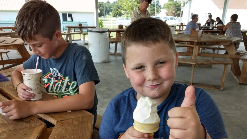 kids eating ice cream at fair