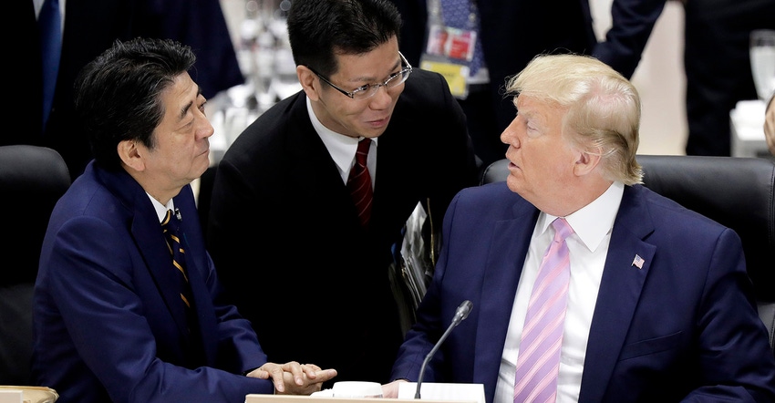 Shinzo Abe, Japan's prime minister (L), and U.S. President Donald Trump (R), talk prior to a working lunch on the first day o