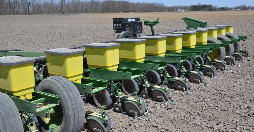 close-up John Deere planter boxes in field