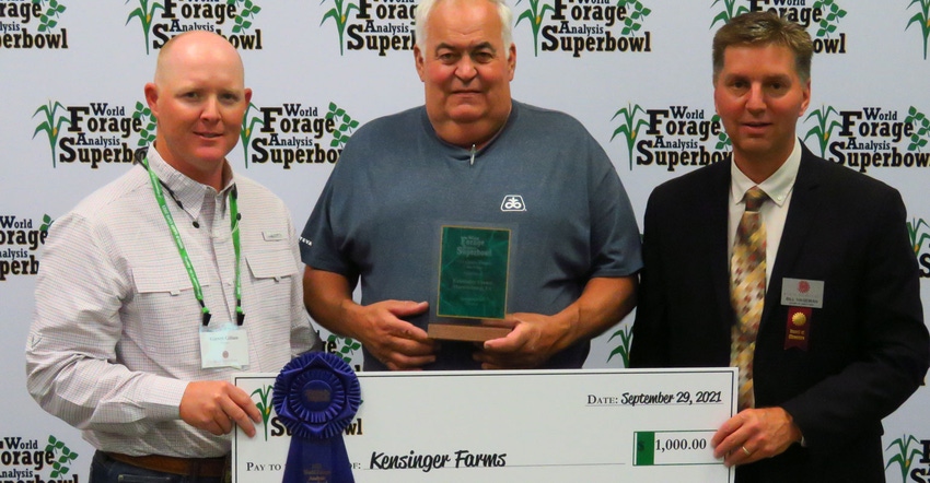 Garrett Gilliam and Bill Hageman award Ernie Kensinger a plaque and a check Garrett Gilliam and Bill Hageman award Ernie Kensinger a plaque and a check