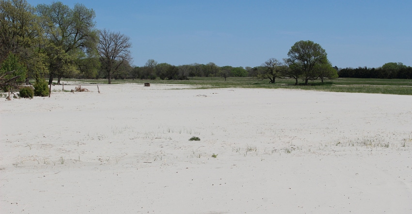 deposited sand on land from flooding