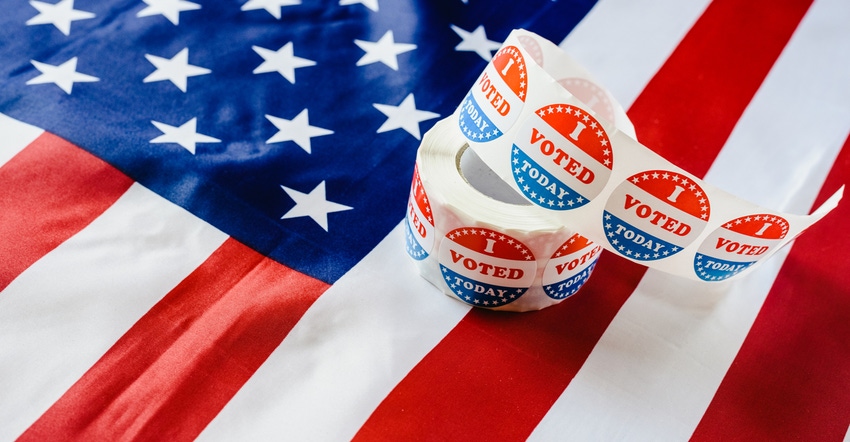 roll of "I Voted Today" stickers on top of American flag roll of "I Voted Today" stickers on top of American flag