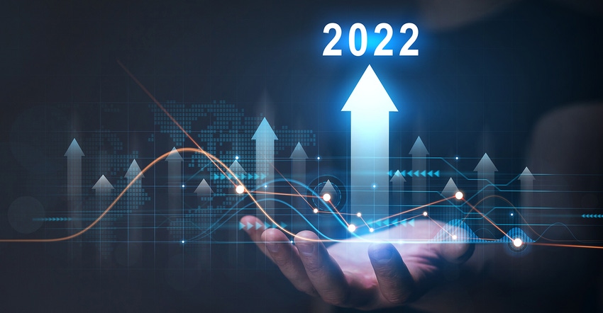 Businessman holding growth graph with year 2022 Businessman holding growth graph with year 2022