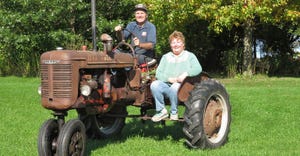 Aaron Gettelman and his wife Patty enjoy riding together on their 1946 Farmall B tractor 