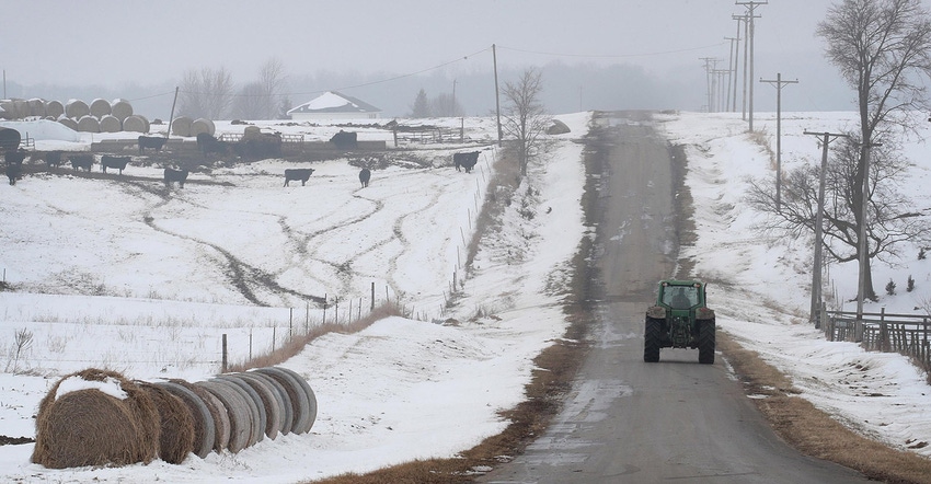 A farmer drives a tractor down a rural road on January 17, 2019 near Ottawa, Illinois.