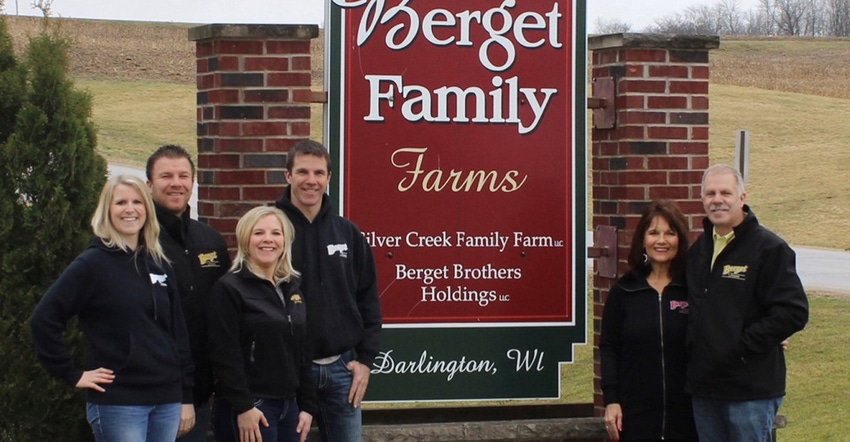 Meghan, Matt, Christina, Scott (deceased), Judy and Mike Berget in front of Berget Family Farms sign