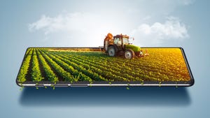 Smart farming concept with tractor on smartphone