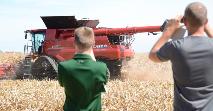 farmers watch demo of Case IH Axial-Flow 9250 combine equipped with a 12-row 4412 corn head at FPVX filming