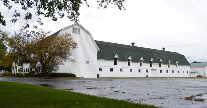 10,000 square-foot white Meadow Brook barn 