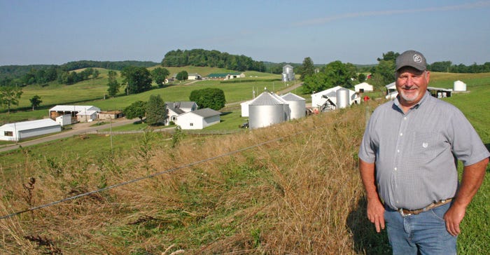 David Felumlee stands atop a field that overlooks his father’s original homestead in the valley of Claylick Run Creek