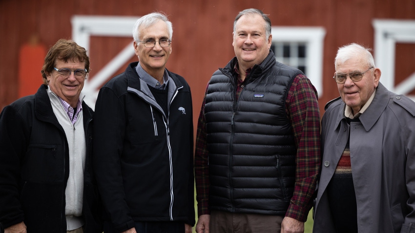 2023 Prairie Farmer Master Farmers standing in front of red barn