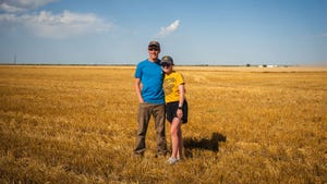 Noah Poynter and Gracie Leonard in a wheat field