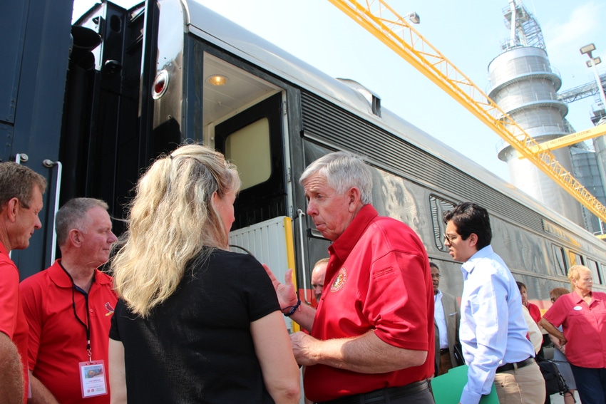 Gov. Mike Parson talks with Marshall City Mayor Julie Schwetz 