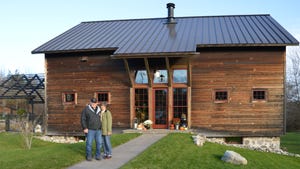 Jim and Laura Dybevik in front of their renovated barn house