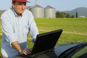 farmer-using-laptop-GettyImages-184293553.jpg