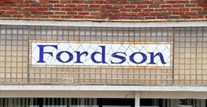 Fordson tractor logo on a stained glass window