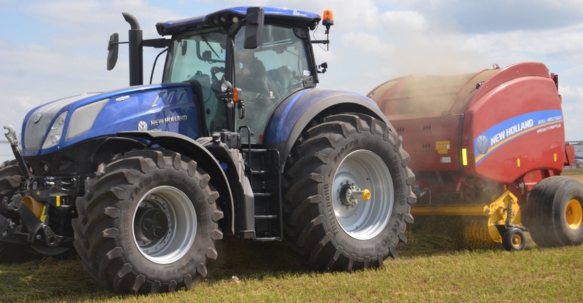 tractor pulling haying equipment