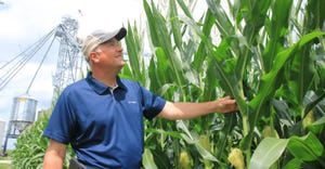 Marc Padrutt next to tall corn