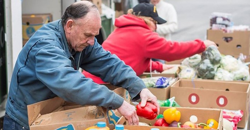 people working at a  Mobile food pantries  which are an integral part Feeding America West Michigan’s effort to provide foo