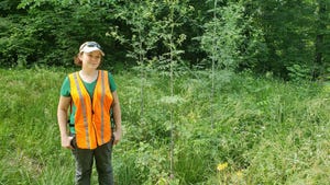 Emily Finch standing in front of poison hemlock