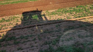 tractor shadow in field