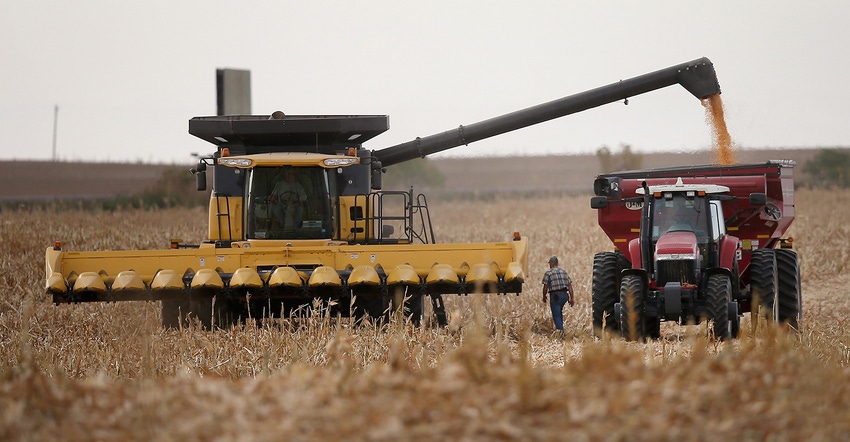 Combine unloading into grain cart Combine unloading into grain cart