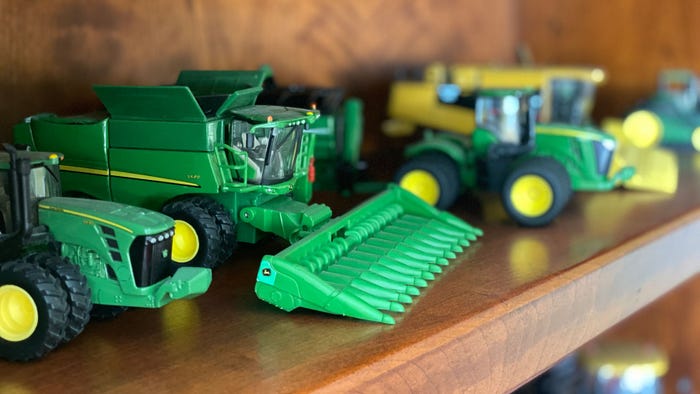 Shelf with toy tractors