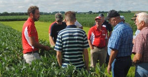 Nebraska Extension crop protection and cropping systems specialist, Justin McMechan  talks with producers pictured here at a 