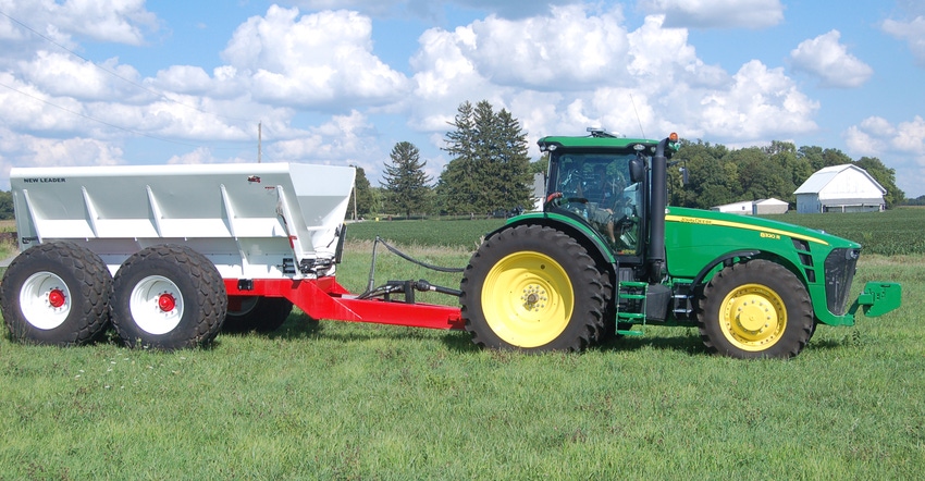 tractor pulling fertilizer wagon