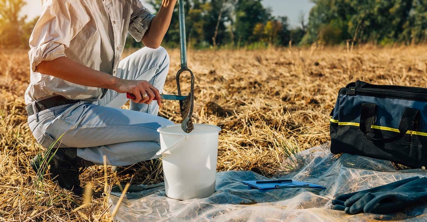 Agronomist collecting a soil sample in Wyoming.