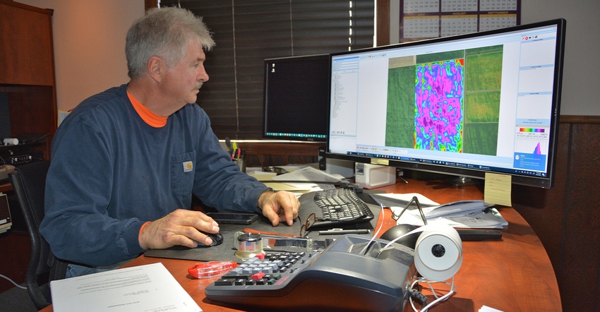 Gary Wagner studies a yield map 