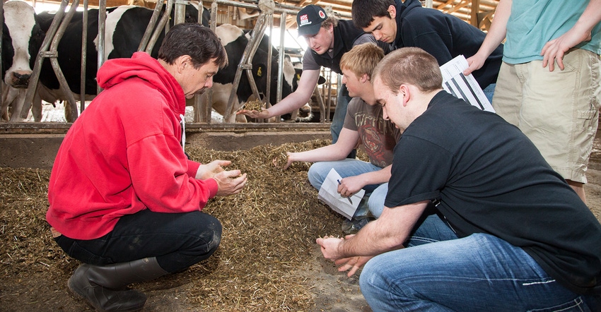 Dr. Randy Shaver in cow barn with dairy science undergraduate students at UW-Madison 