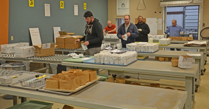 Workers check in soil samples arriving at A&L Great Lakes Labs, Ft. Wayne