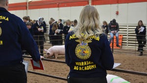 Picture of back of an FFA student wearing FFA jacket