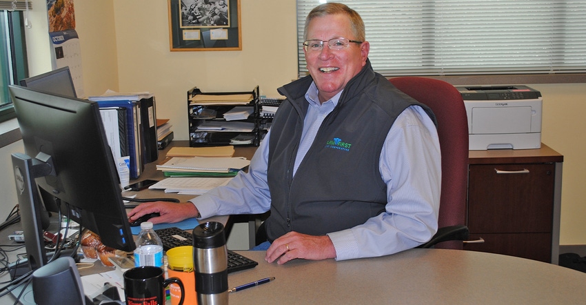  Jeff Lyon, general manager of FamilyFirst Dairy Cooperative, seated at desk