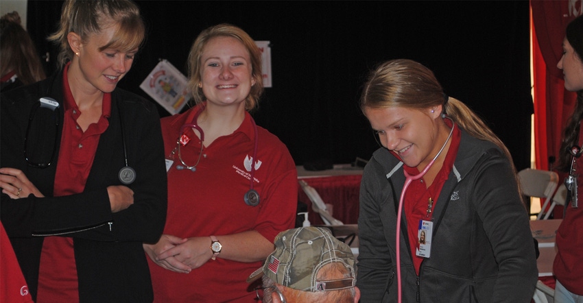 :  UNMC Kearney Division CON students help with blood pressure checks and skin cancer screenings at the Hospitality Tent at H
