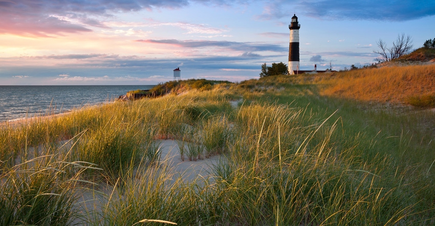 "Image of the Big Sable Point Lighthouse and the Lake Michigan shoreline, Michigan, USA."