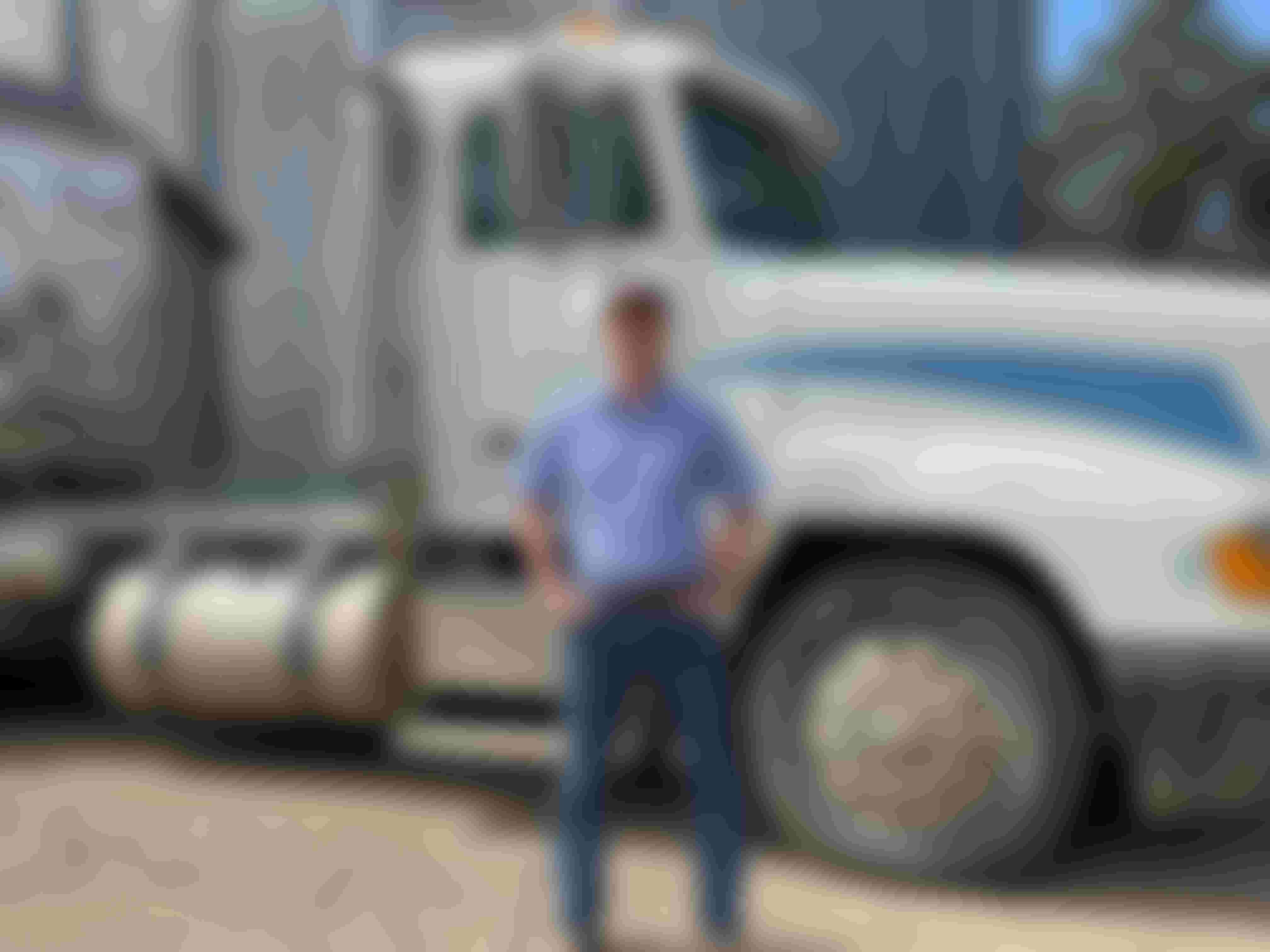 Man posed in front of semi truck