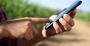 Farmer holding smartphone