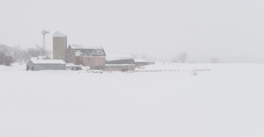 rural farm during snowstorm