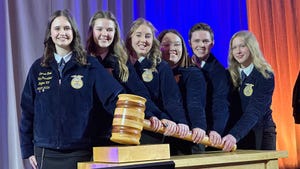 six FFA students posing with oversized gavel