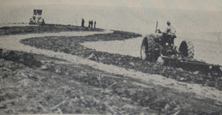 old b/w picture from 1949 of tractors in field