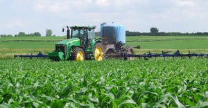 sprayer in cornfield
