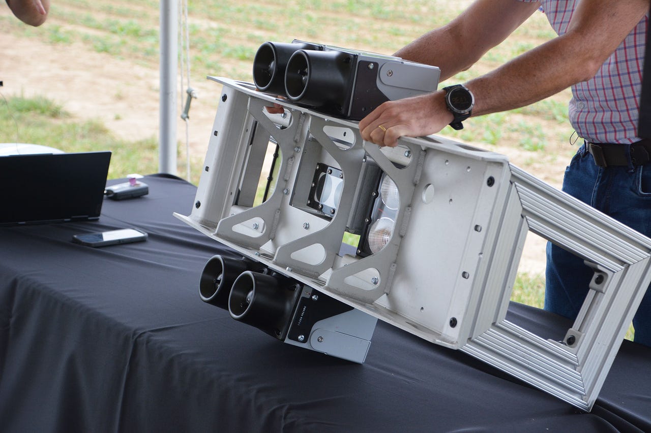 Close up of cameras and nozzles beneath Verdant Robotics precision sprayer