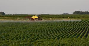 sprayer spraying soybean field