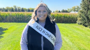Alice in Dairyland Taylor Schaefer wears a mink vest and stands in front of a cornfield