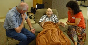 Karl Siebert, left and his wife, Carol, right visit with his uncle John G. Siebert during a family reunion shortly before his
