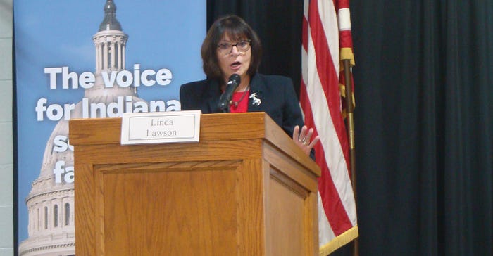 Linda Lawson speaking at podium