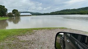 The Winooski River flooding over Conant’s Riverside Dairy farm in Richmond, Vermont